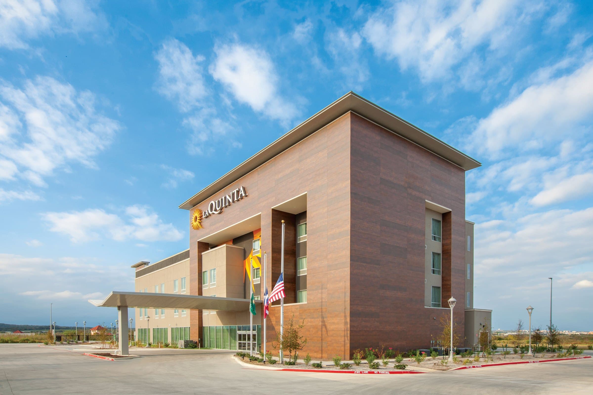 The hotel's brick exterior against a Texas sky